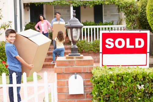 Professional movers handling furniture during a Wembleypark house move