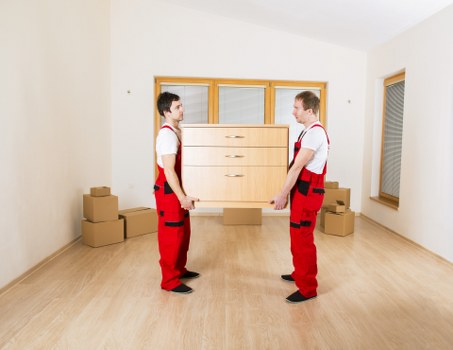 Packed boxes and household items arranged for temporary storage